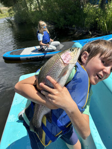 Young Fisherman Catches a Beautiful Rainbow